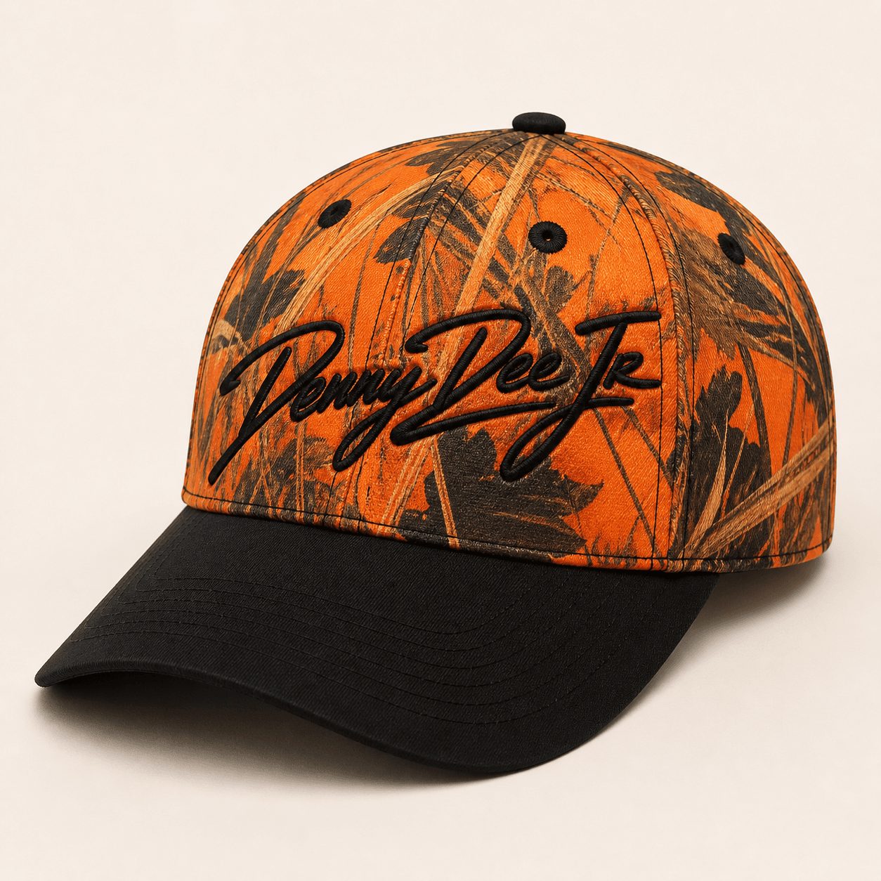 Blaze-orange duck-camo baseball cap with a black brim and embroidered Denny Dee Jr signature